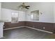 Dining room with wood-style laminate flooring, light fixtures, and a mirror at 10622 N Malachite Way, Casa Grande, AZ 85122