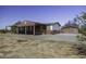 Inviting single-story home with covered patio, desert landscaping, and a detached garage at 10622 N Malachite Way, Casa Grande, AZ 85122