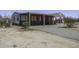 Charming single-story home with a long, covered carport and desert landscaping at 10622 N Malachite Way, Casa Grande, AZ 85122