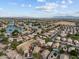 Aerial view of the neighborhood with beautiful lakes, mountain views and well-manicured yards at 11405 W Windsor Ave, Avondale, AZ 85392