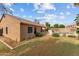 The private backyard oasis is fully fenced, features mature trees, lush shrubbery, and an in-ground pool at 11405 W Windsor Ave, Avondale, AZ 85392