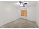 Bedroom with carpet, ceiling fan, and window offering natural light at 11405 W Windsor Ave, Avondale, AZ 85392
