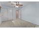 Bedroom with carpet flooring, ceiling fan and large closets at 11405 W Windsor Ave, Avondale, AZ 85392