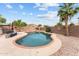 Private in-ground pool with beautiful brick trim and ample deck space, perfect for entertaining and relaxation at 11405 W Windsor Ave, Avondale, AZ 85392