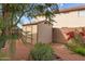 Backyard features a storage shed, blooming flowers and mature landscaping at 11405 W Windsor Ave, Avondale, AZ 85392