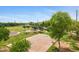 Aerial view of a full basketball court at park, with playground, picnic benches, trees, and walking path at 1316 S Minneola Ln, Gilbert, AZ 85296