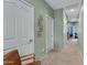 Hallway featuring neutral-colored walls and carpet with a chair and interior doors at 1316 S Minneola Ln, Gilbert, AZ 85296