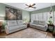 Comfortable living room features two sofas and lots of natural light from large windows at 1316 S Minneola Ln, Gilbert, AZ 85296