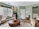 Elegant living room featuring a chandelier, hardwood floors, and stylish furnishings, creating a welcoming ambiance at 1316 S Minneola Ln, Gilbert, AZ 85296