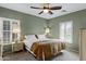 Well-decorated bedroom with beautiful furniture, lamps and a large window for natural light at 1316 S Minneola Ln, Gilbert, AZ 85296