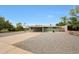 Single story home features an arid front yard and a covered driveway at 1320 E Butler Dr, Phoenix, AZ 85020