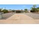 Single story home features an arid front yard and a covered driveway at 1320 E Butler Dr, Phoenix, AZ 85020