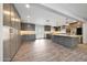 Spacious kitchen features custom gray cabinets, stainless steel appliances, and a large island at 1320 E Butler Dr, Phoenix, AZ 85020