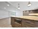 Kitchen with center island and breakfast bar, light countertops and gray cabinets at 1320 E Butler Dr, Phoenix, AZ 85020