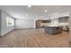 Open-concept living area flows into a modern kitchen with gray cabinets and stainless appliances at 1320 E Butler Dr, Phoenix, AZ 85020