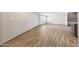 Spacious living room boasts wood-look tile flooring and a large window at 1320 E Butler Dr, Phoenix, AZ 85020