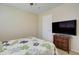 Well lit bedroom with light colored walls, neutral carpet, and nice dresser at 14298 W Amelia Ave, Goodyear, AZ 85395