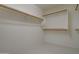 Walk-in closet with shelving, providing ample storage space at 14298 W Amelia Ave, Goodyear, AZ 85395