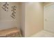 Hallway with decorative floral wall hangings and door at 14298 W Amelia Ave, Goodyear, AZ 85395