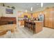 Spacious kitchen with a central island, breakfast bar, and ample cabinet space for storage at 14298 W Amelia Ave, Goodyear, AZ 85395