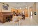 Bright kitchen boasts an island with bar stools, breakfast table, and ample cabinet space at 14298 W Amelia Ave, Goodyear, AZ 85395