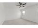 Bright bedroom with a ceiling fan and a window providing natural light at 16938 N Verde Pl, Maricopa, AZ 85138