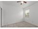 Bedroom featuring neutral carpet, a window, ceiling fan and closet at 16938 N Verde Pl, Maricopa, AZ 85138