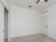Bright bedroom featuring neutral carpet, a ceiling fan, and white trim throughout the room at 16938 N Verde Pl, Maricopa, AZ 85138
