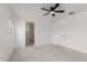 Well-lit bedroom with ceiling fan, window, and doorway to closet/bathroom at 16938 N Verde Pl, Maricopa, AZ 85138