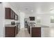 Kitchen with stainless steel appliances, granite countertops and a large island at 16938 N Verde Pl, Maricopa, AZ 85138