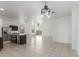 Open concept kitchen with stainless steel appliances and granite countertops and an island at 16938 N Verde Pl, Maricopa, AZ 85138