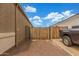 Gated side yard with desert landscaping, convenient for storage at 16938 N Verde Pl, Maricopa, AZ 85138
