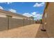 Side yard offering desert landscaping and privacy block wall at 16938 N Verde Pl, Maricopa, AZ 85138