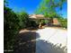 Spacious backyard with large patio and landscaping offers a delightful space for outdoor enjoyment at 18166 W Camino Real Dr, Surprise, AZ 85374