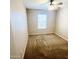 Bedroom with carpet flooring, a window, and a ceiling fan at 18166 W Camino Real Dr, Surprise, AZ 85374