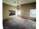 Primary bedroom with neutral walls, carpet flooring, and a ceiling fan at 18166 W Camino Real Dr, Surprise, AZ 85374