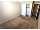 Cozy bedroom features neutral paint, plush carpet, and a convenient closet for ample storage at 18166 W Camino Real Dr, Surprise, AZ 85374