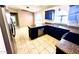 Kitchen with stainless steel appliances, granite countertops, and tiled floors at 18166 W Camino Real Dr, Surprise, AZ 85374