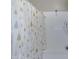 Clean shower with a modern curtain and tile, complemented by stylish fixtures and pristine white walls at 18366 N Arbor Dr, Maricopa, AZ 85138