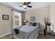 Charming bedroom with patterned bedding, neutral walls, and lots of natural light at 18366 N Arbor Dr, Maricopa, AZ 85138