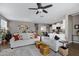 Bright living room with neutral tones, plush rug, comfortable sofa, and stylish decor at 18366 N Arbor Dr, Maricopa, AZ 85138
