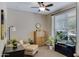 Office space featuring a cozy seating area, a ceiling fan, and a window with natural light at 18366 N Arbor Dr, Maricopa, AZ 85138