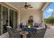 Cozy covered patio with comfortable seating and modern decor, perfect for relaxing evenings at 18366 N Arbor Dr, Maricopa, AZ 85138