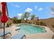 Private backyard oasis featuring a pristine pool, desert landscaping, and lounge chairs at 18366 N Arbor Dr, Maricopa, AZ 85138