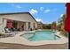 Backyard pool and covered patio, perfect for outdoor entertaining and relaxation on sunny days at 18366 N Arbor Dr, Maricopa, AZ 85138