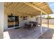 Covered back patio provides ample space for outdoor seating and entertainment at 18427 N 32Nd Ln, Phoenix, AZ 85053