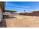 Spacious backyard awaiting personalization, showcasing a covered patio and secure fencing at 18427 N 32Nd Ln, Phoenix, AZ 85053