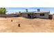 Expansive backyard with potential for customization, featuring a covered patio and privacy fence at 18427 N 32Nd Ln, Phoenix, AZ 85053