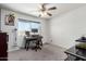 Bedroom featuring neutral carpet and a window with views of the neighborhood at 18427 N 32Nd Ln, Phoenix, AZ 85053
