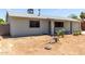 Cozy single-story home with a light gray paint and neat landscaping at 18427 N 32Nd Ln, Phoenix, AZ 85053